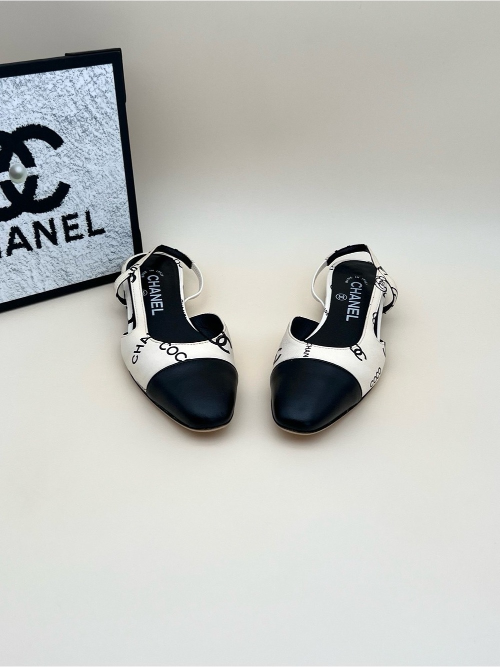 CHANEL Black and White Logo Cap-Toe Slingback Mules